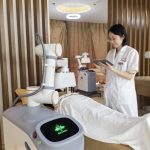 A thermal moxibustion robot performs an AI-guided treatment session with precise temperature control in a modern wellness center.